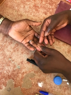 Fasting glucose test with glucometer, Saint-Louis, Senegal. Photo by the author, 2019.