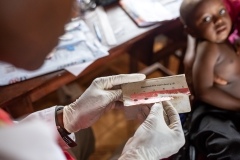 Haemoglobin testing at a Community Health Centre, Sierra Leone. Photo by Olivia Acland, 2019.